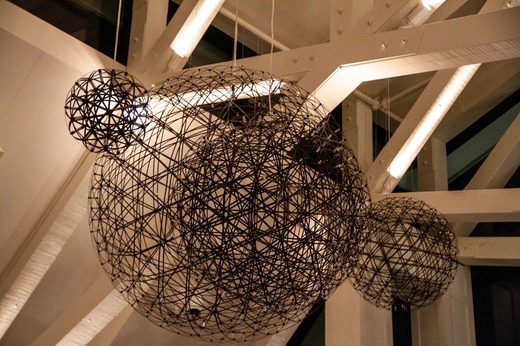 Picture of three decorative wire orbs hanging from a ceiling