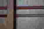 Close-up photograph of a Japanese-style wooden door