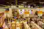 Interior photo of Portland's Kinokuniya Japanese bookstore, with blurred/transparent figures
