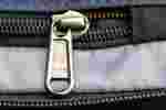 Photo of a partially unzipped YKK zipper pull