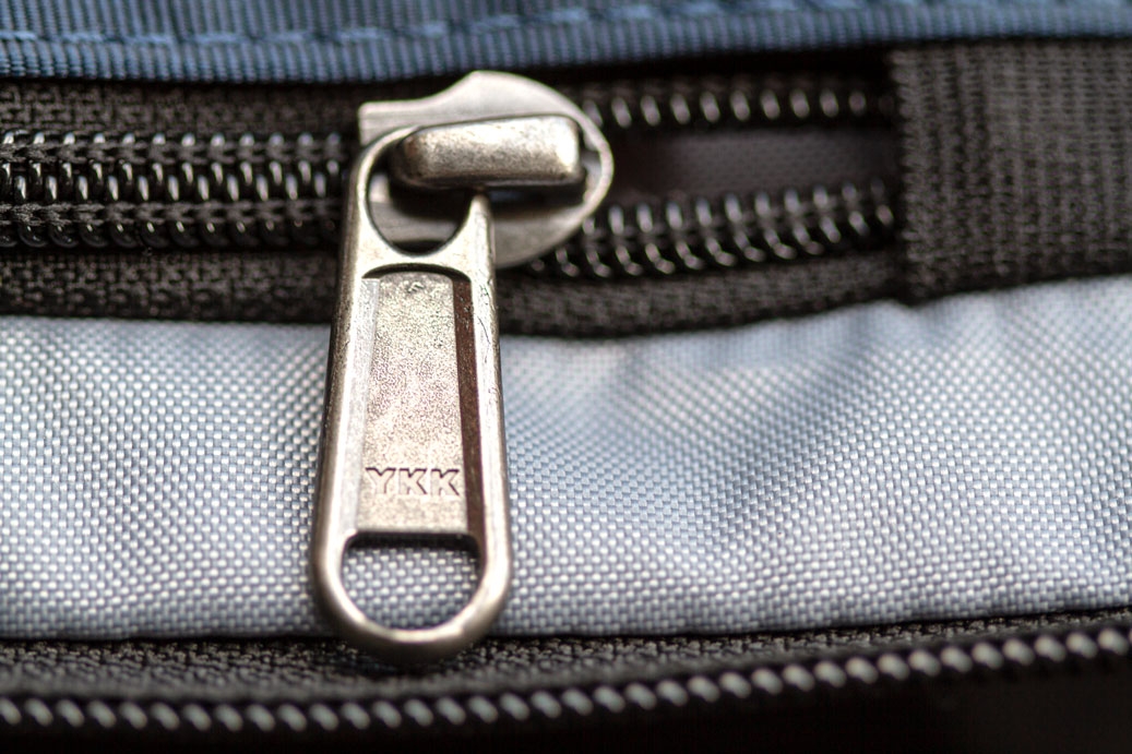 Photo of a partially unzipped YKK zipper pull